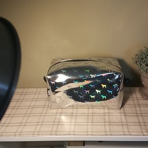 Victoria Secret iridescent silver dog pouch.